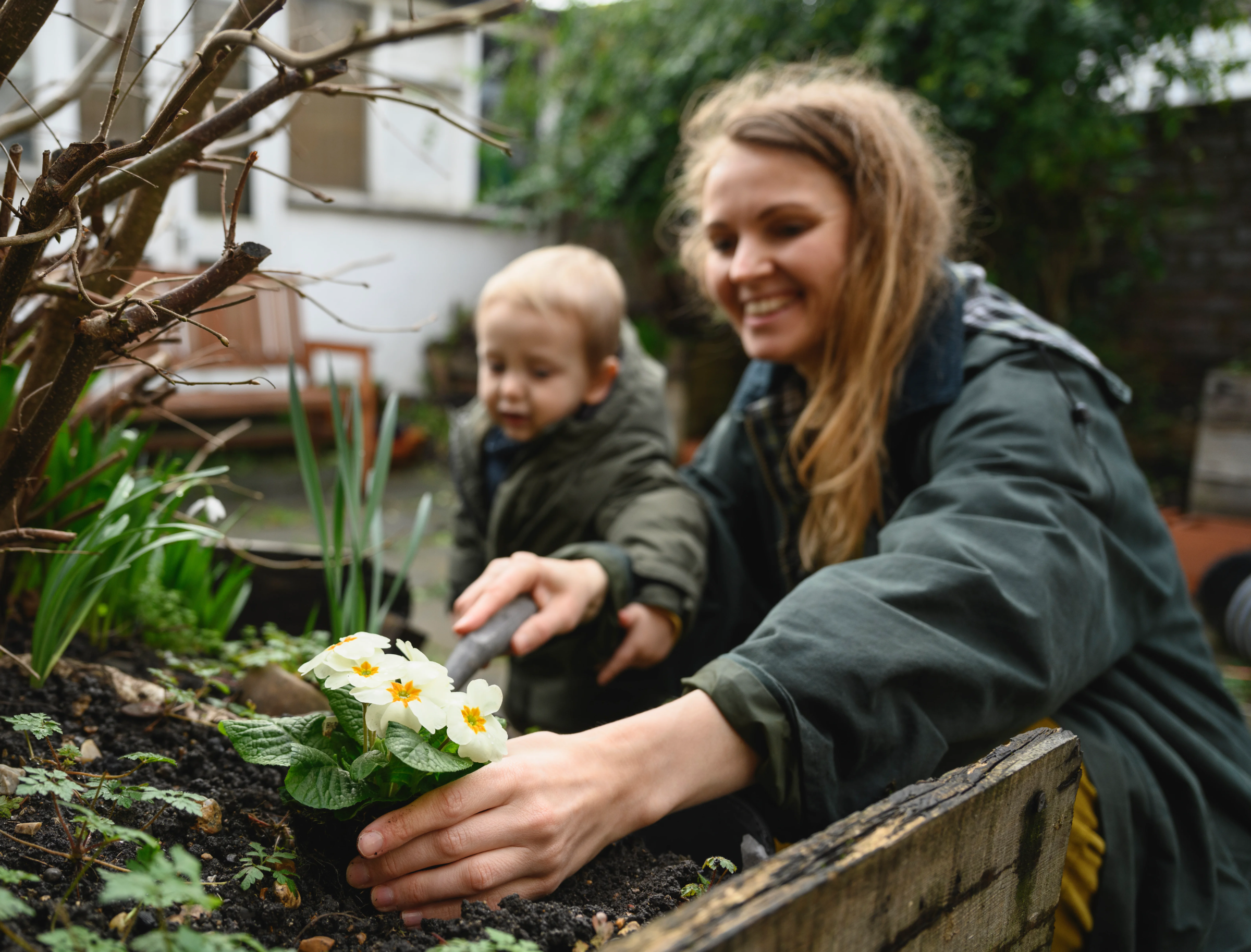 mother in garden with child - home insurance - doddl