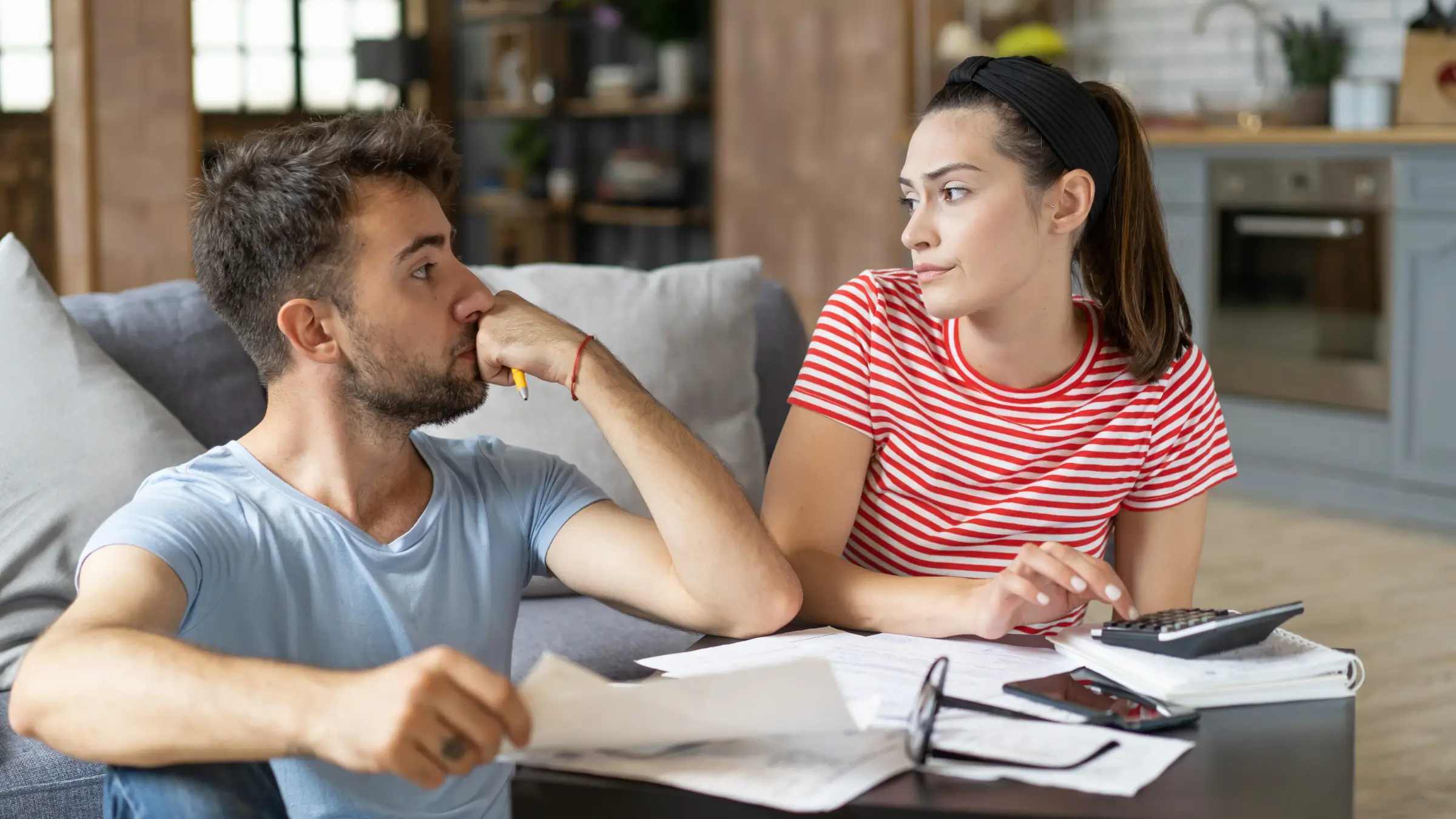 young couple organising home finances - mortgages - doddl