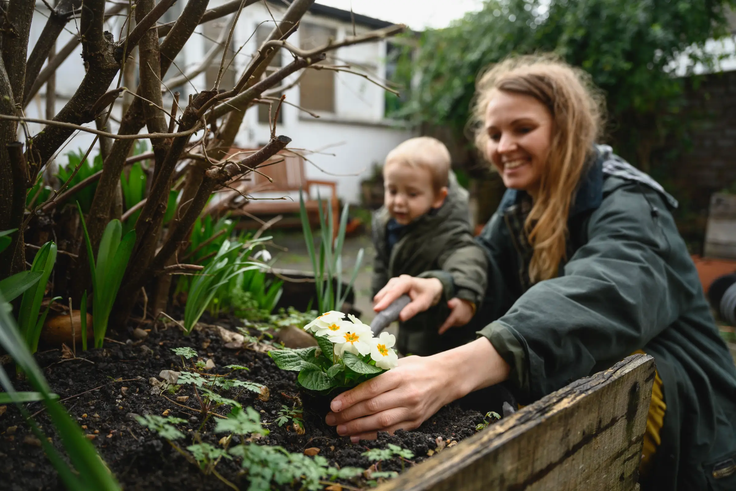 young family in new home garden - mortgage protection - doddl
